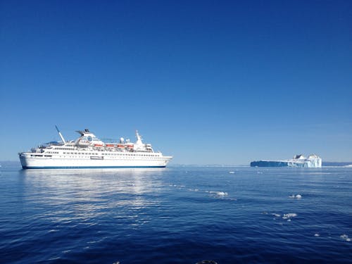 White Cruise Ship on Blue Ocean under the Blue Sky