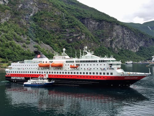 Nordnorge Passenger Ship on the Sea near a Mountain 