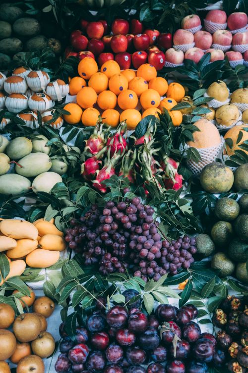 Free A colorful fruit assortment at a Vietnamese market stall showcasing fresh produce. Stock Photo