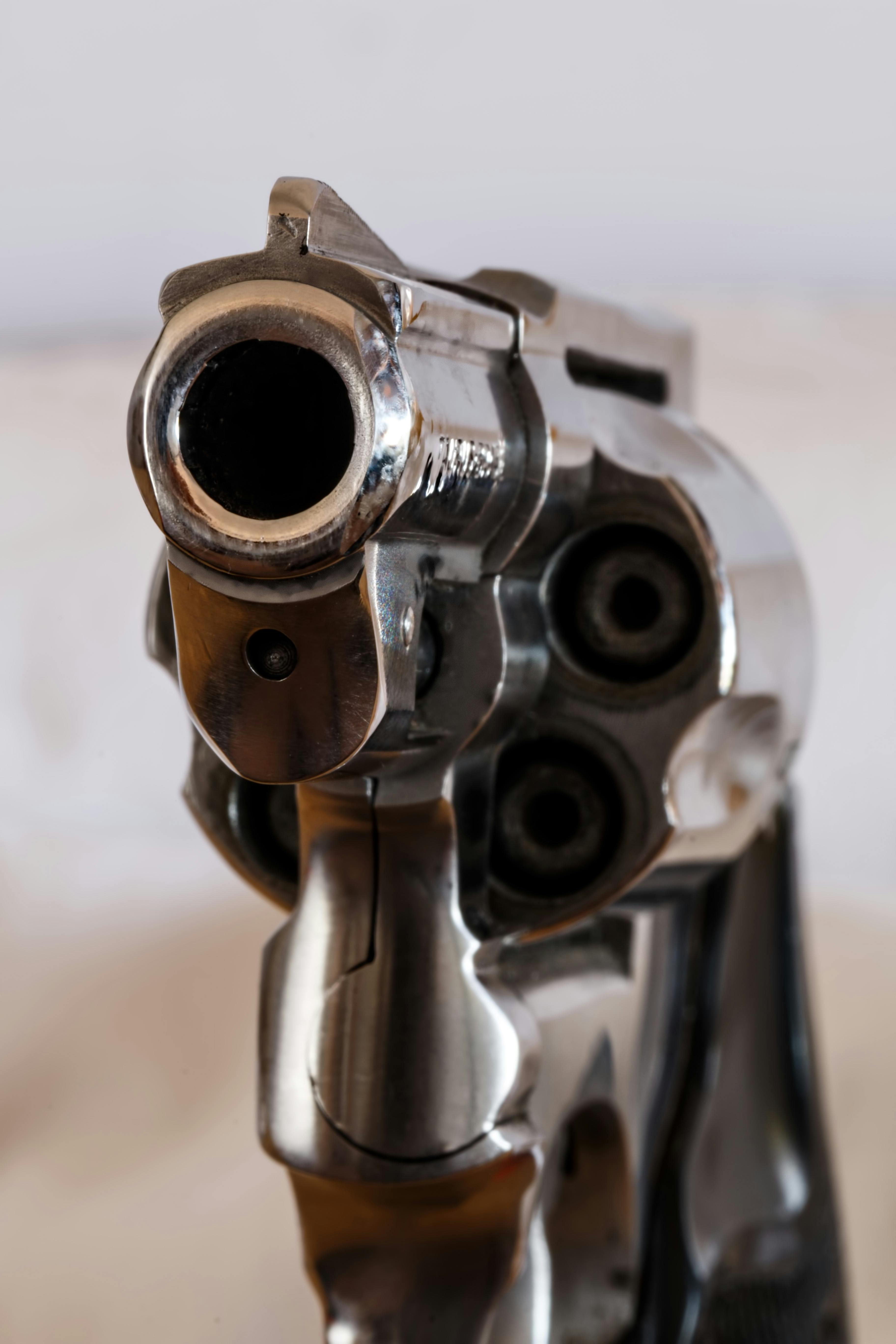 Premium Photo  Revolver hand gun wallpaper with line art in dark contrast  background