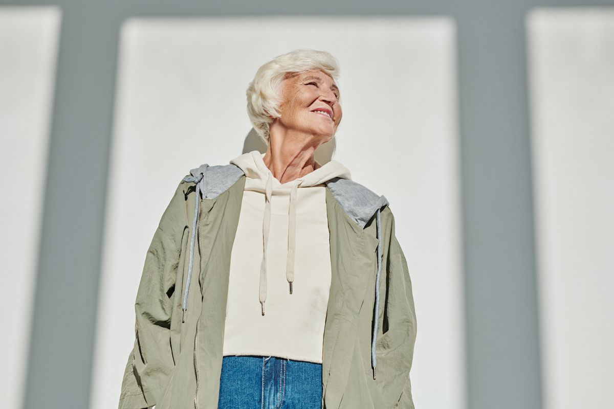 Healthy smiling mature woman in her fifties looking confident and well