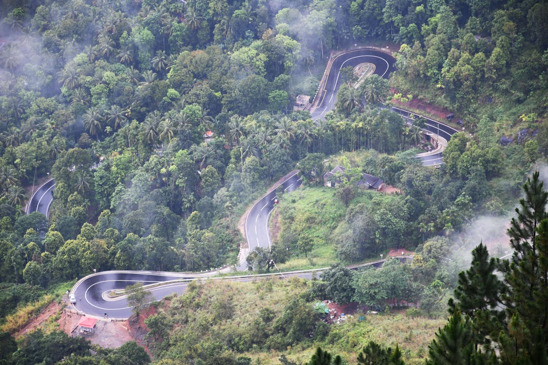 Free An Aerial View of a Winding Mountain Road Stock Photo