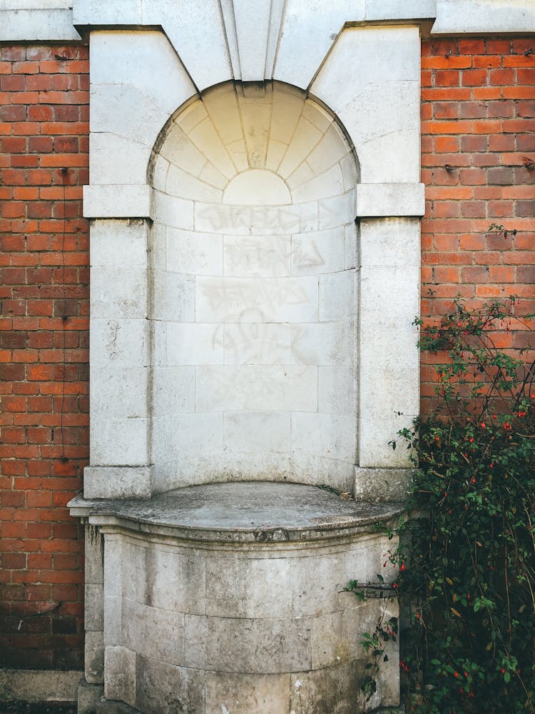 Concrete Tomb With Red Brick Wall