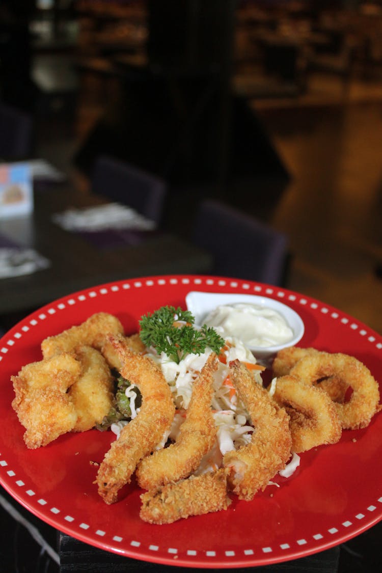 Deep Fried Shrimps And Squid On Red Plate