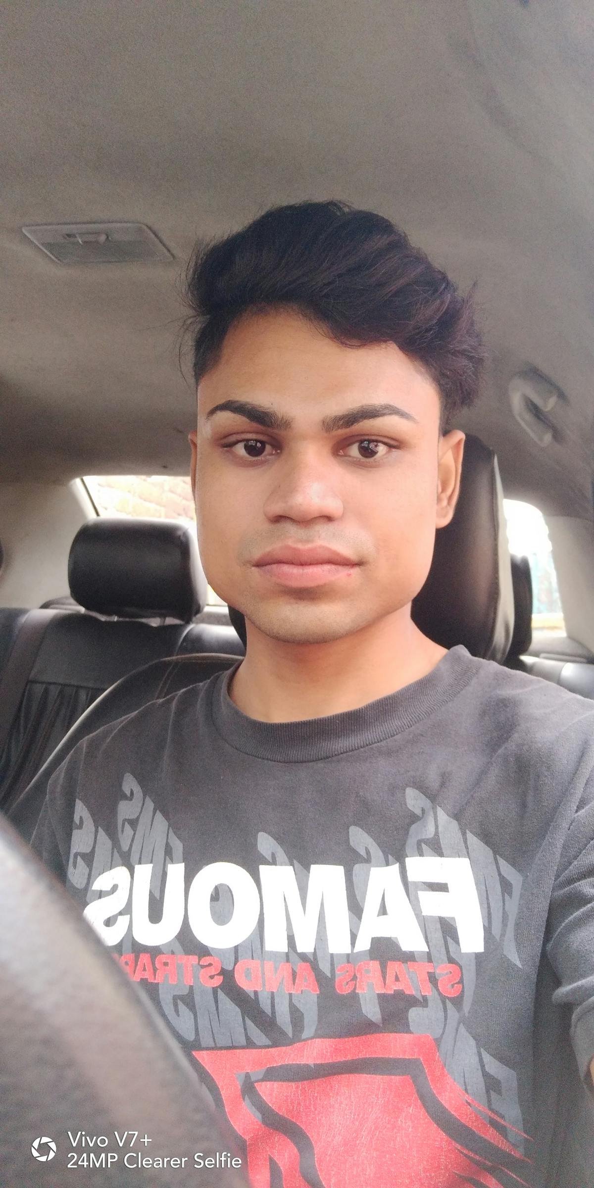 Person holding a bowl of yogurt and fruit, ready to eat