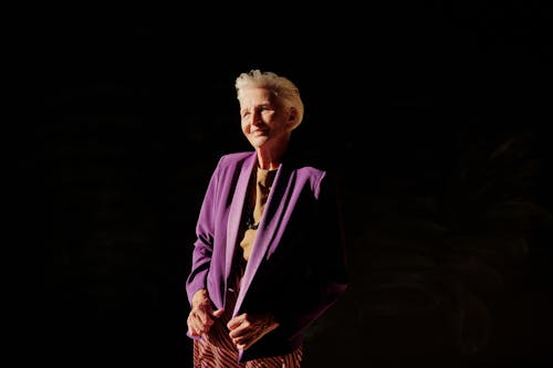 Woman in Purple Blazer Standing