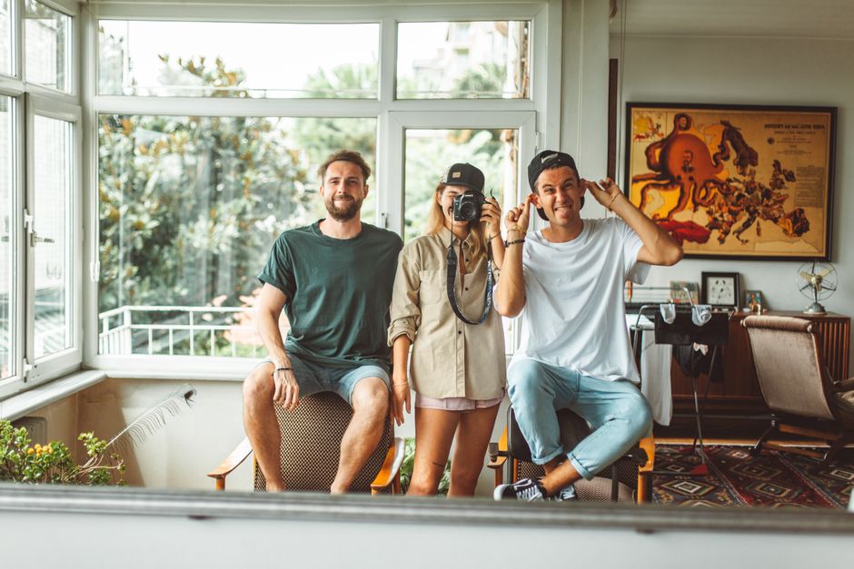 Photo by ROMAN ODINTSOV on Pexels Group of friends having fun posing for a photo indoors, capturing a playful moment.