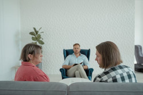 Free A Counselor Listening to a Married Couple Marital Problems Stock Photo