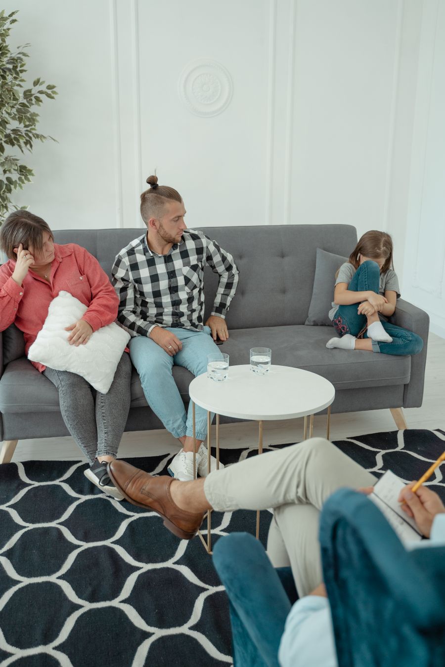 Family discussing communication and home recovery planning during counseling