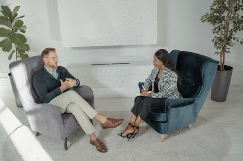Free A Man and a Woman in Interview Session Stock Photo