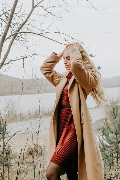 Free Blonde woman in a fashionable coat and dress outdoors in Minsk, showcasing fall style. Stock Photo