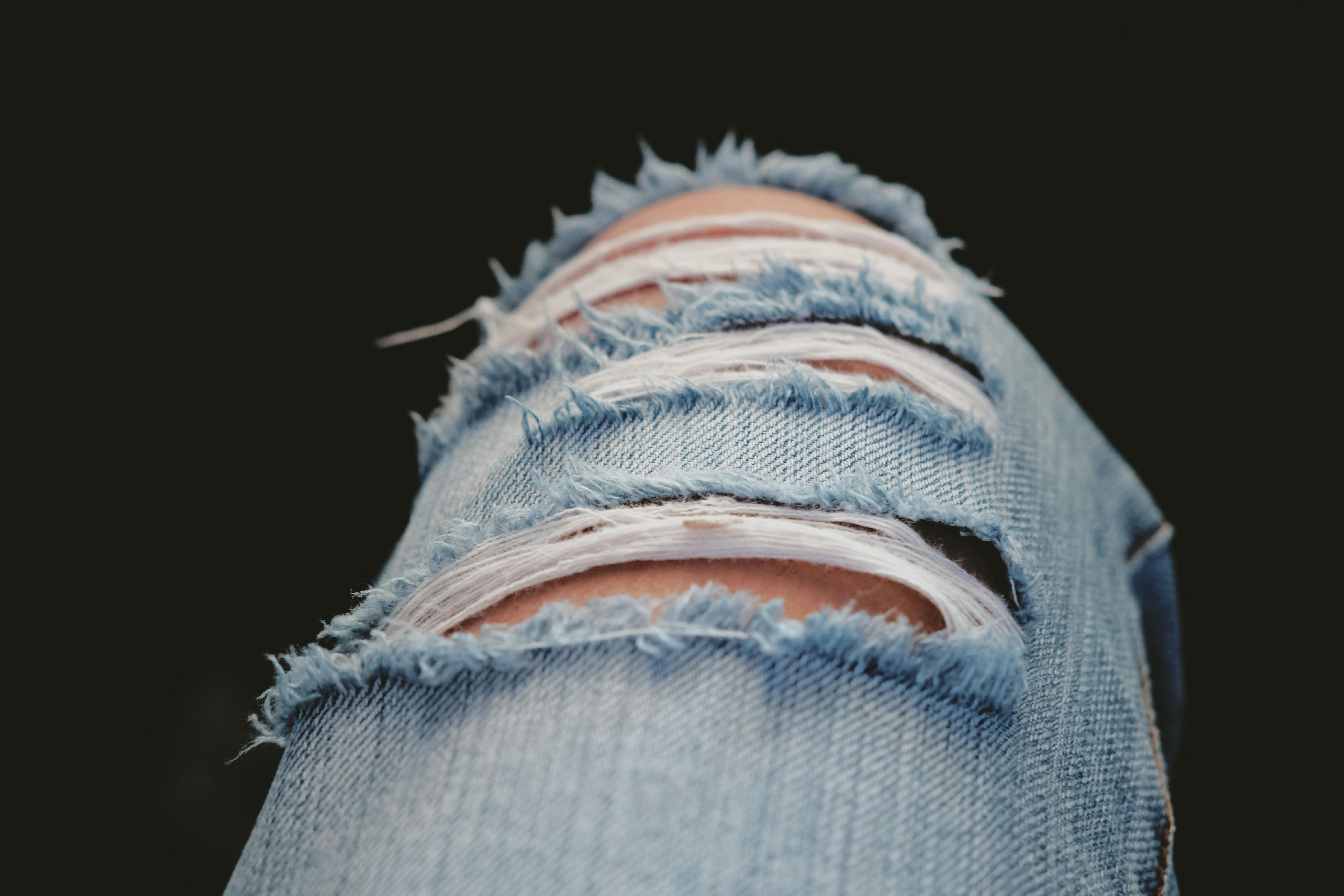 Black Denim Jeans on White Panel · Free Stock Photo