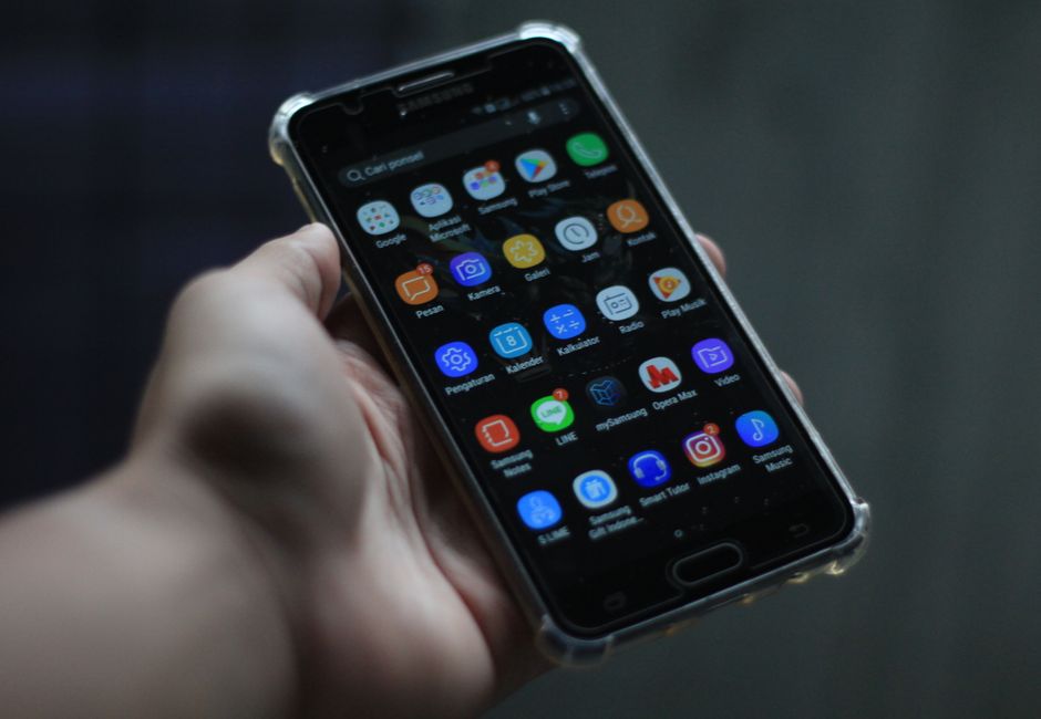 Close-up of a smartphone showcasing various mobile applications on its display.
