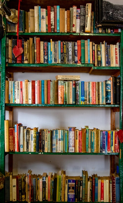Free Books Arranged in a Bookshelf Stock Photo