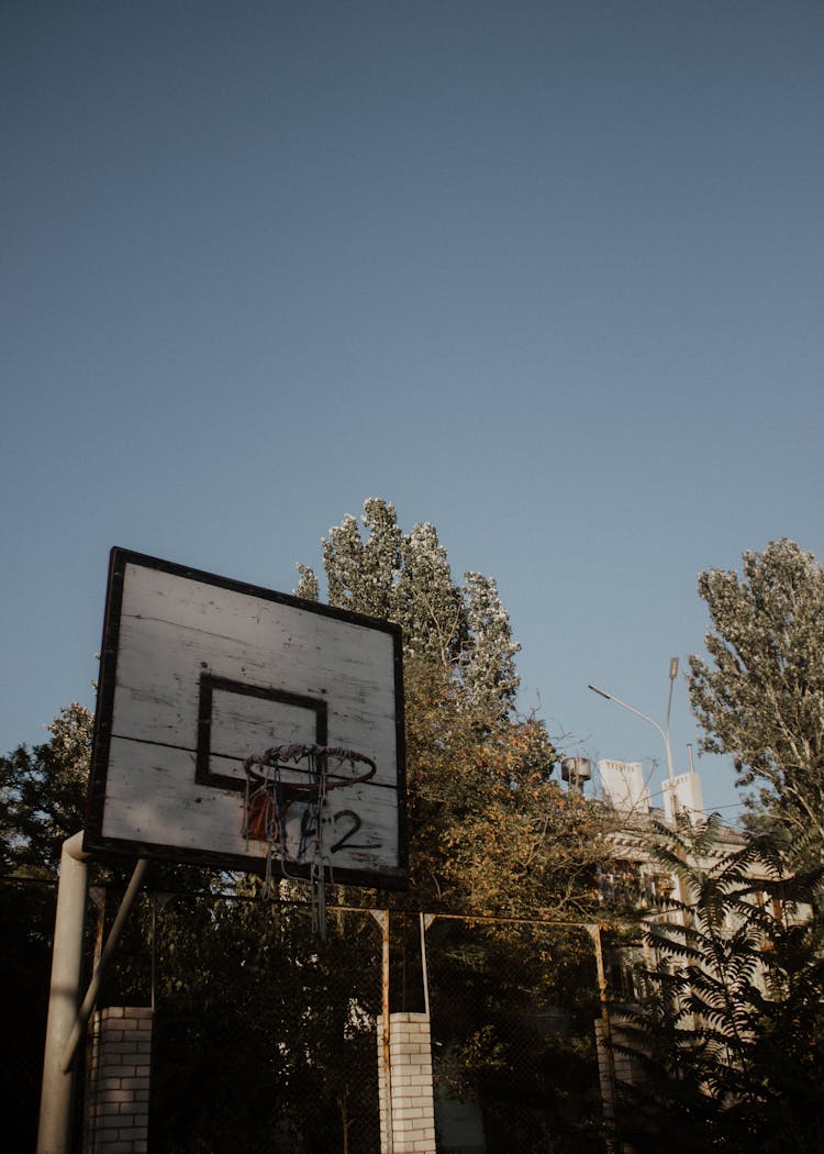 Wooden Backboard And A Basketball Hoop