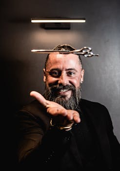 A bearded man in a black suit skillfully balances scissors, capturing a unique moment.