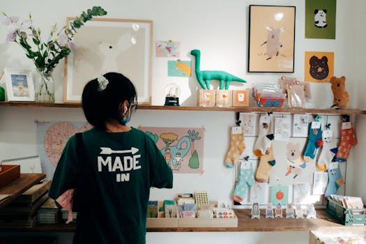 A vibrant interior of a gift shop displaying toys, socks, and wall decor, with a person browsing items.