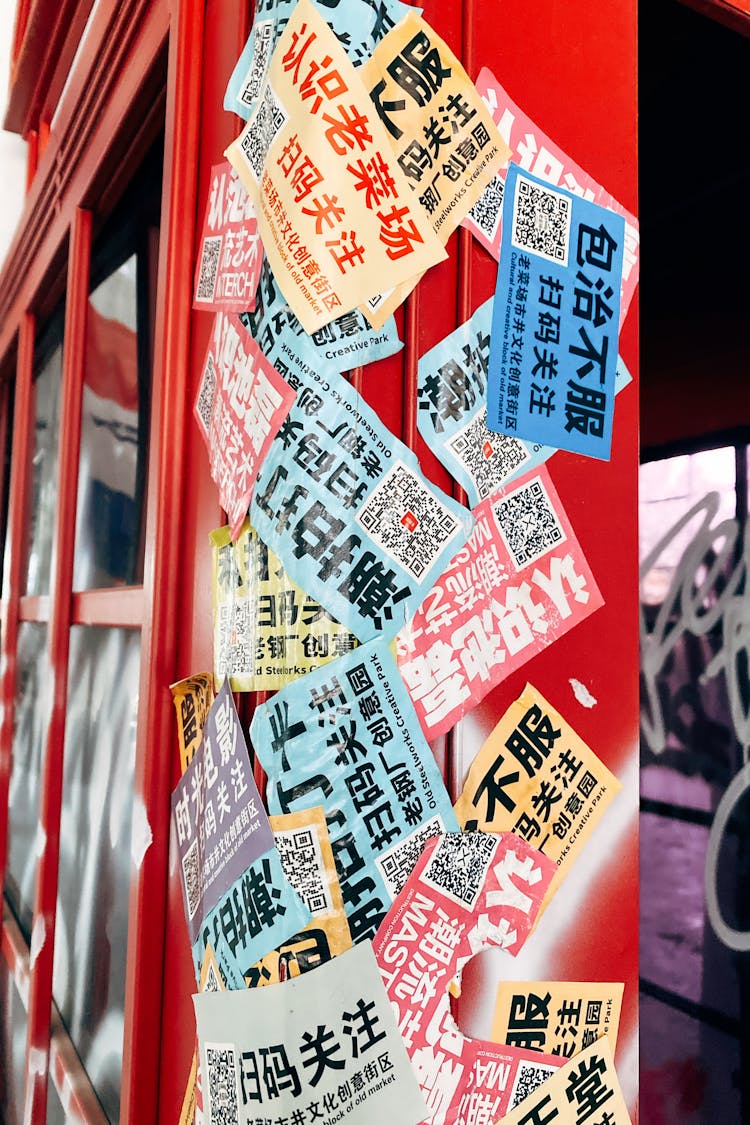 Variety Of Stickers On A Red Booth