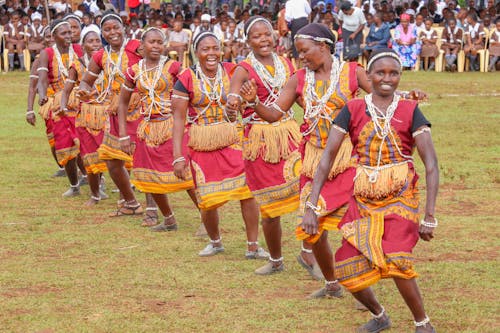 Women in Traditional Clothes Dancing Together