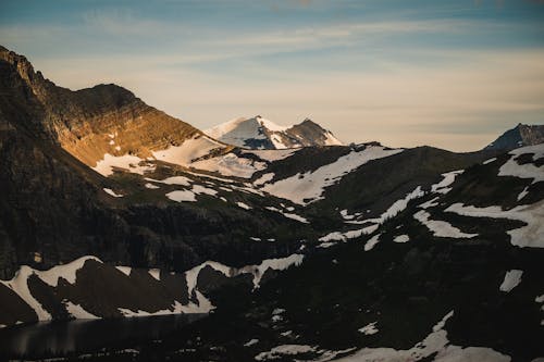 Mountain with Melting Snow Under the Sky