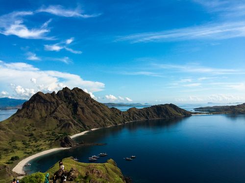 Free Breathtaking aerial view of rocky mountains and blue ocean in Komodo, Indonesia. Stock Photo