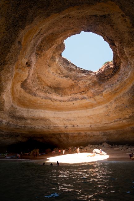 Explore the breathtaking Benagil Cave with sunlight streaming through its iconic opening.