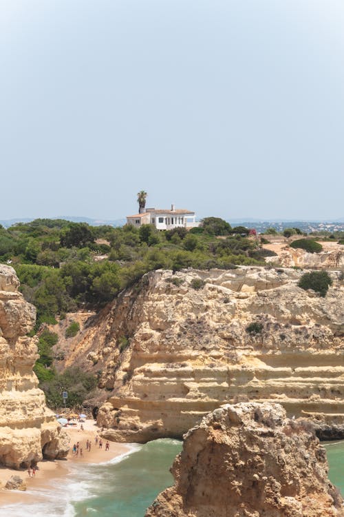 House on Top of Cliffs on a Seashore 