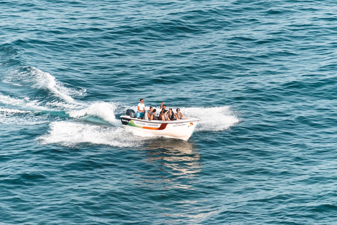 People Riding Boat on the Sea · Free Stock Photo