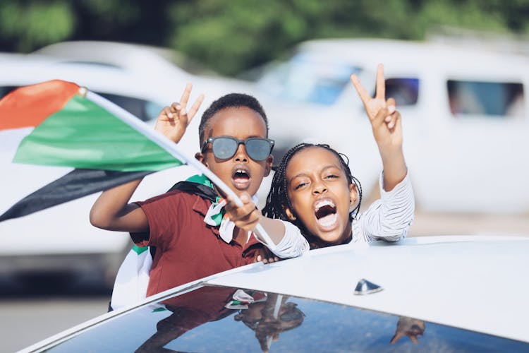 Woman And Boy Showing Peace Sign