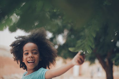 Free Girl with Afro Hair Smiling Stock Photo
