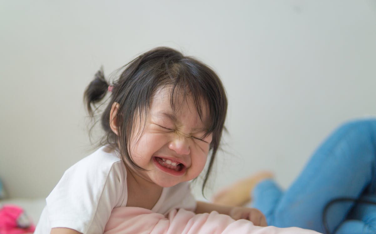 Small Asian girl with closed eyes