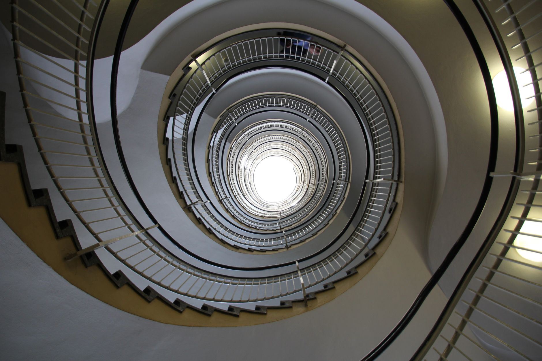 A stunning view of a modern spiral staircase showcasing geometric elegance and architectural beauty.