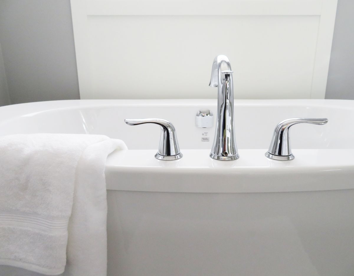 compact wet room with shower, toilet and glass screen