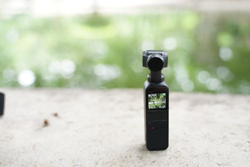 Free A Portable Video Camera Recorder on Concrete Stock Photo