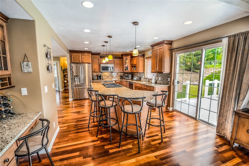 Hardwood floor Photo by Pixabay from Pexels: https://www.pexels.com/photo/kitchen-island-and-barstools-534151/