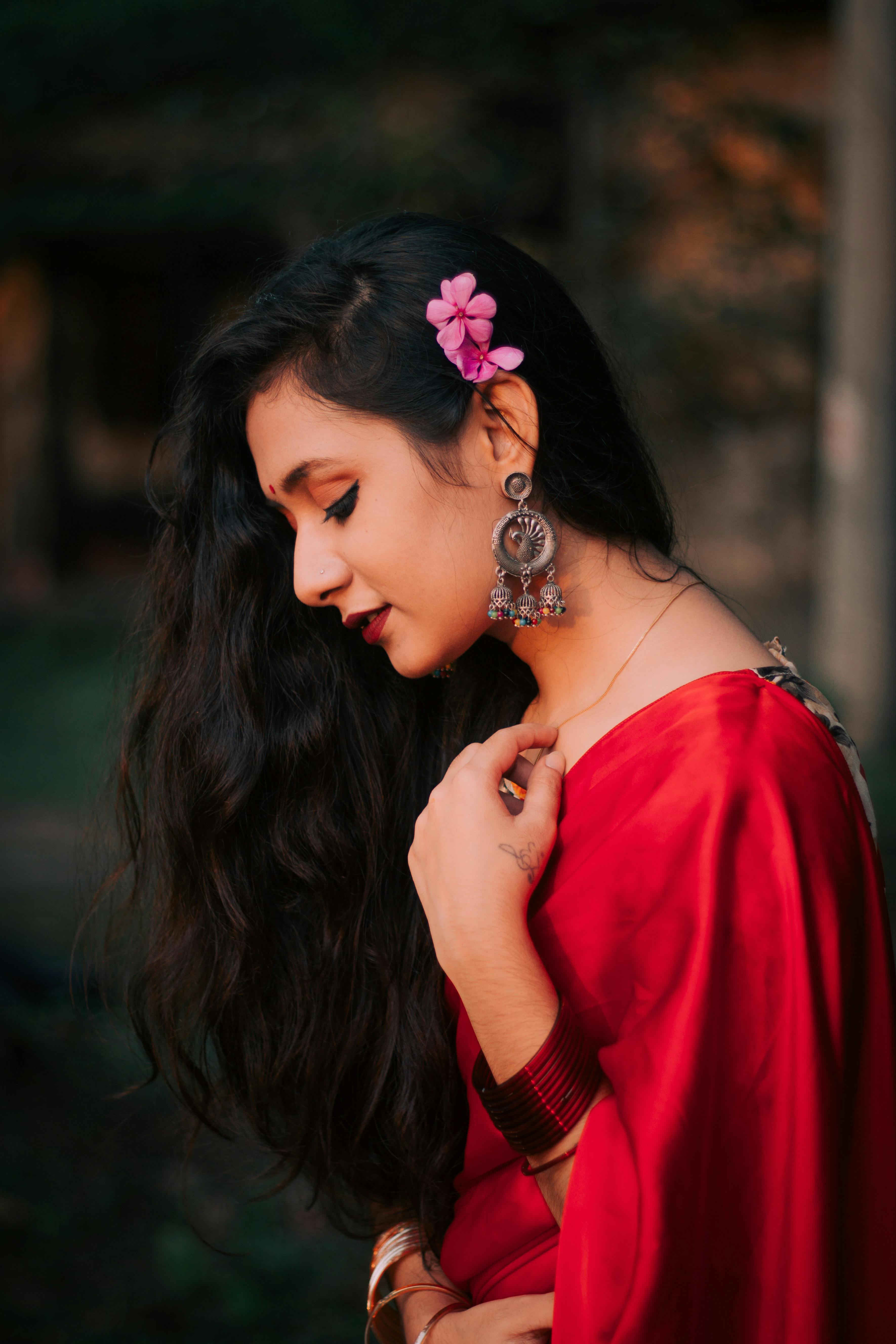 Elegant brunette south asian indian girl in saree standing under