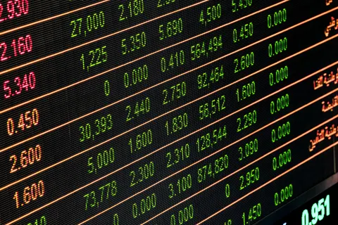 Rows of numbers and figures on a stock market display screen