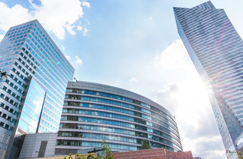 Curved glass office buildings from below