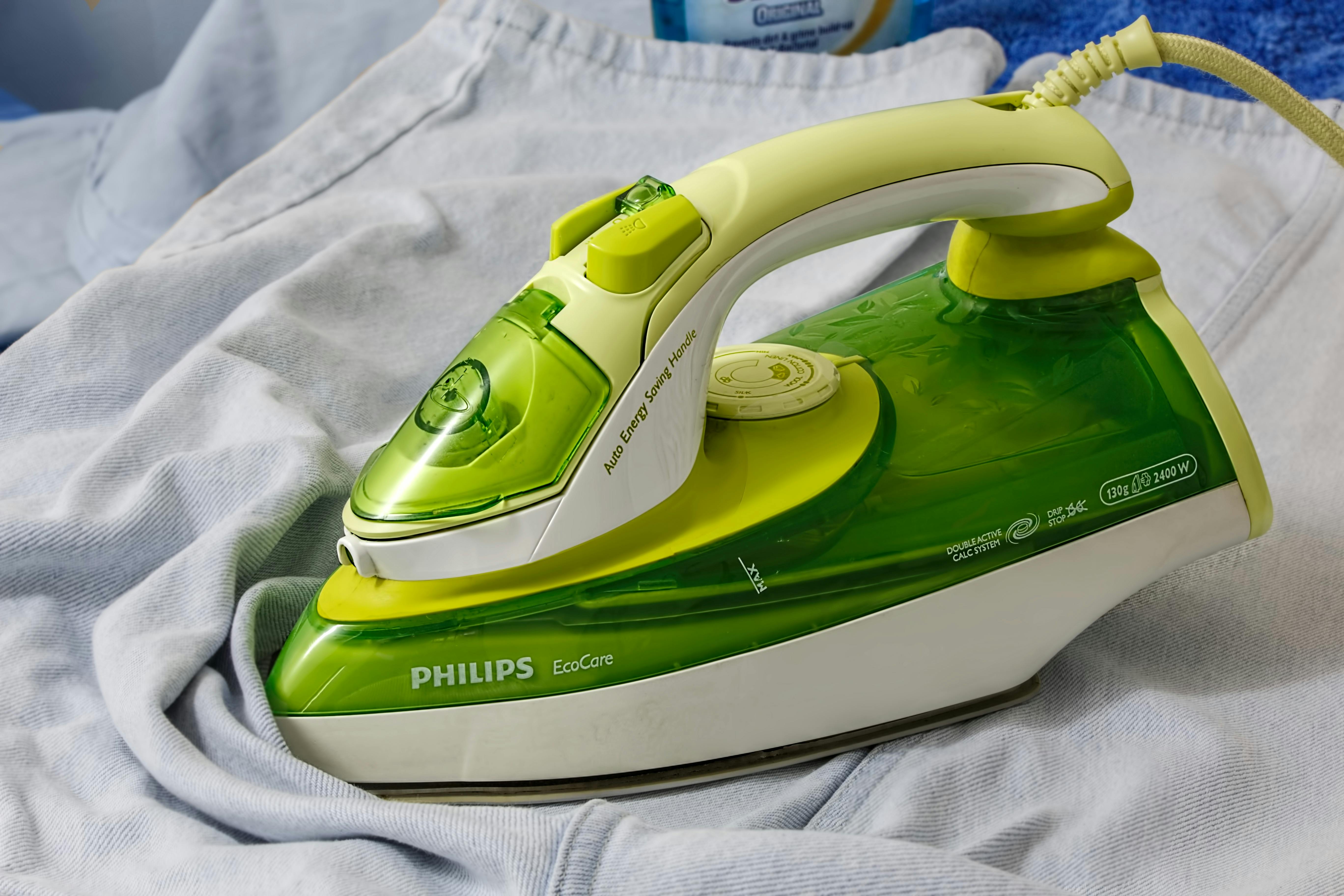 Woman Hand Ironing A Shirt, On Cloth Background Stock Photo, Picture and  Royalty Free Image. Image 15726334.