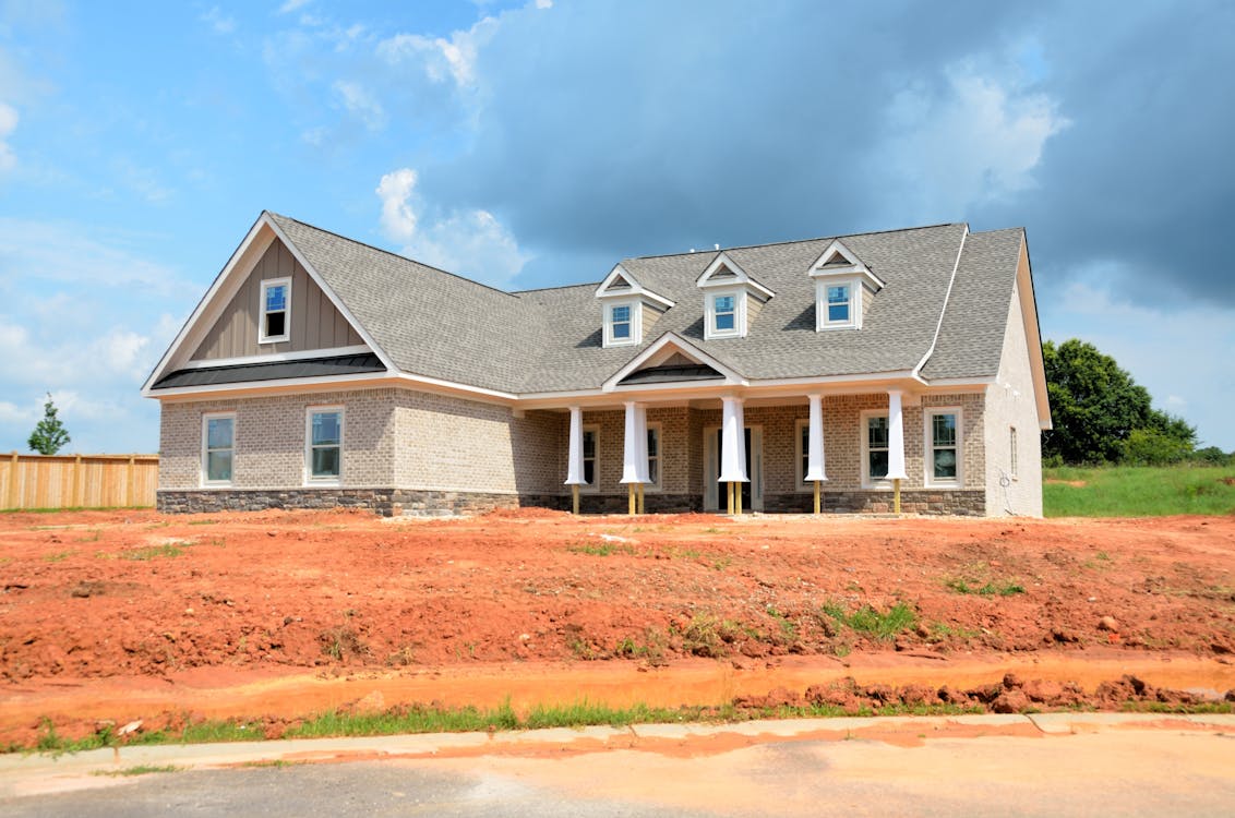 Free Gray Bungalow House Under Blue And White Cloudy Sky Stock Photo