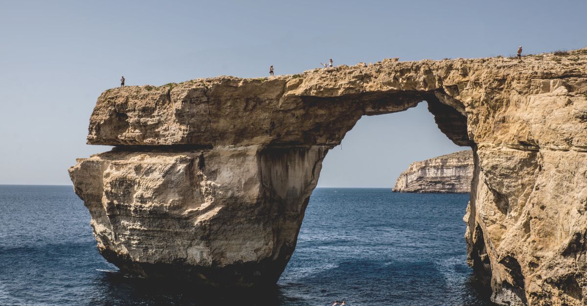 Stunning view of the Azure Window in Gozo, Malta, showcasing the arch formation on a sunny day.