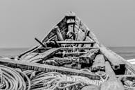 Grayscale Photo of a Wooden Boat