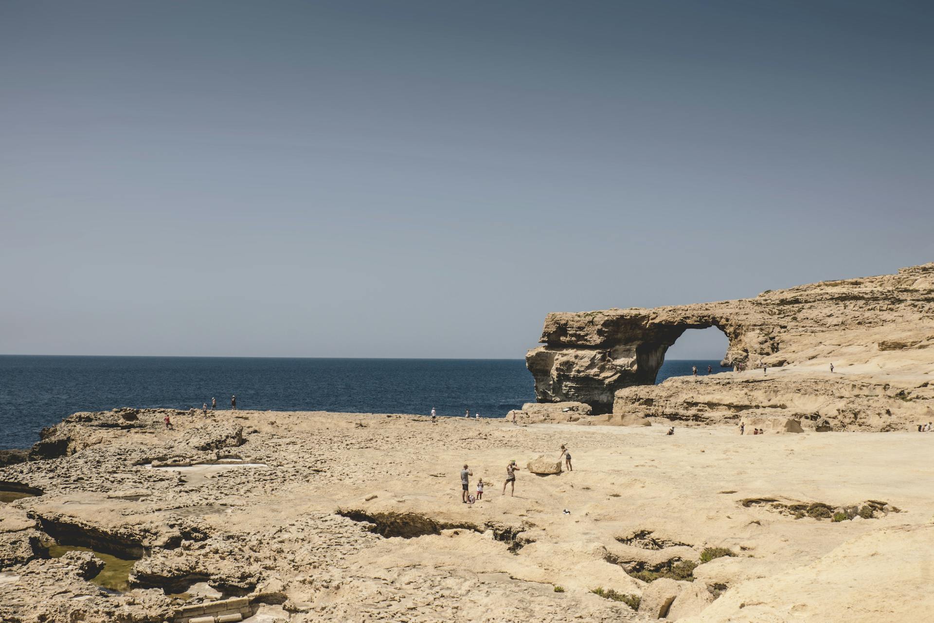 Breathtaking view of the Azure Window ruins at Mgarr, Malta featuring rocky cliffs and the Mediterranean Sea.