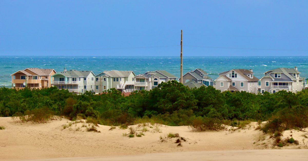 Charming beach houses overlooking sandy dunes and ocean in Nags Head, North Carolina.