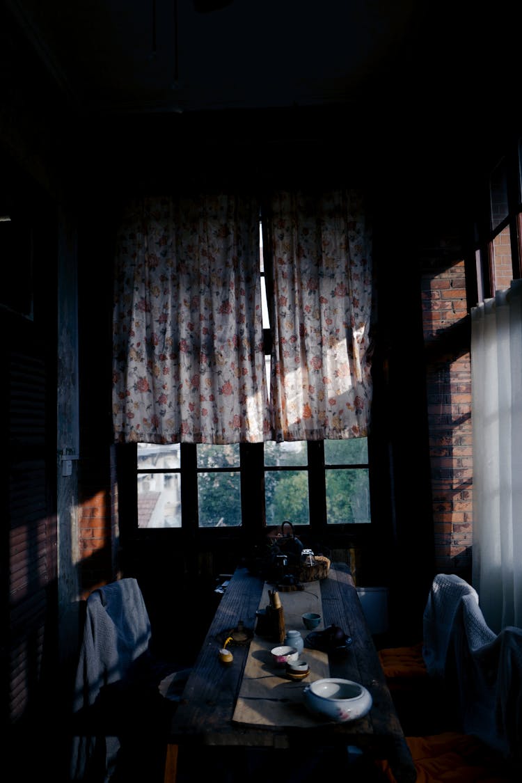 Dining Table In A Dark Narrow Room 