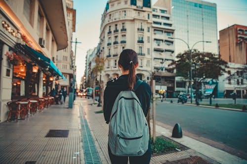 Back View of a Woman Carrying Backpack