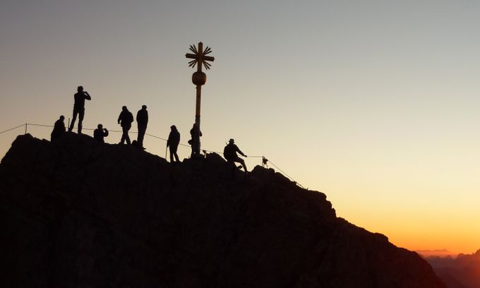 Mountaineer on a snowy ridge at sunrise — photo by Pixabay on Pexels