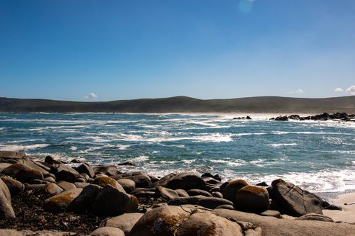 Free Breathtaking rocky seaside view with clear blue sky on the West Coast of South Africa. Stock Photo