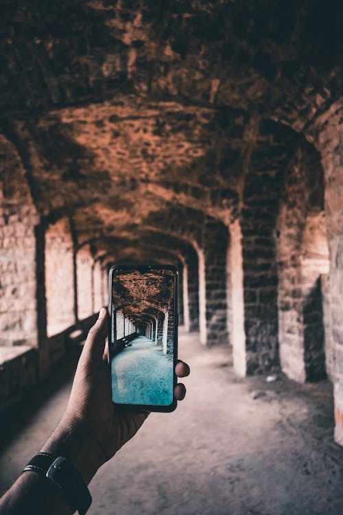 A Person Taking Photo of a Tunnel