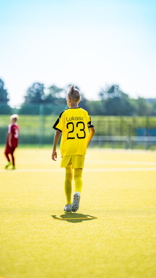 Back View of Boy on Soccer Field